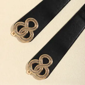 Ceinture élastique noire pour femme avec boucle dorée texturée en forme d'infini