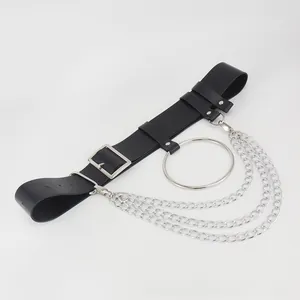 Detail of punk black PU leather belt with large silver metal ring and triple chains