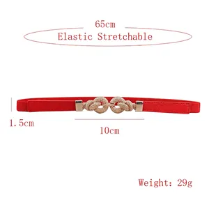 Red elastic skinny waist belt for women with golden interlocking heart buckle detail