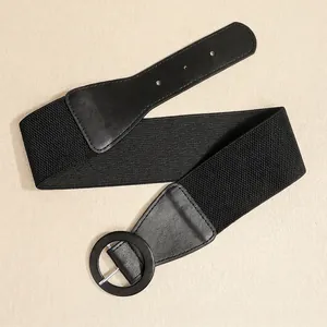 Fashionable elastic wide waist belt with a black circular buckle for dresses and coats