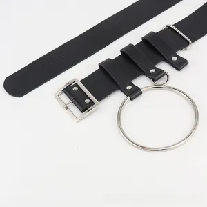 Close-up of black PU leather punk belt featuring a large silver metal ring decoration