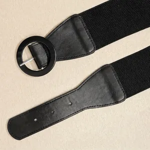 Fashionable black wide elastic waist belt with a round pin buckle for women dresses