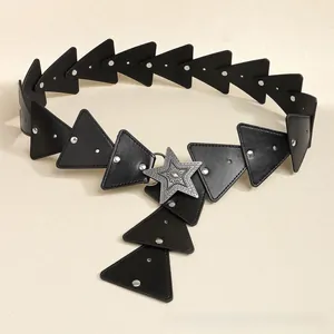 Close-up of bohemian style leather belt with silver star buckle and rivet details
