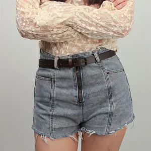High-waisted light blue denim shorts with frayed hem and dark brown leather belt