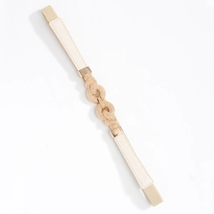 Detail of thin cream elastic waist belt featuring a gold double-ring rhinestone buckle