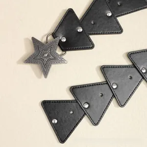 Close-up of bohemian leather belt featuring retro star buckle and triangular patchwork
