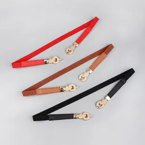 Elastic skinny belts in black, red, and brown with gold knot buckle for women's dresses