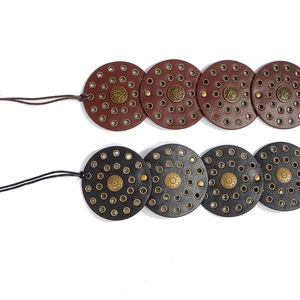 Bohemian style studded oval disk belt for women in black and brown leather options