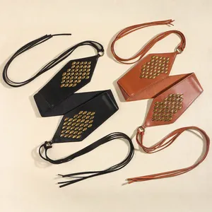 Vintage suede waist belt with metallic studs and lace-up straps for dresses