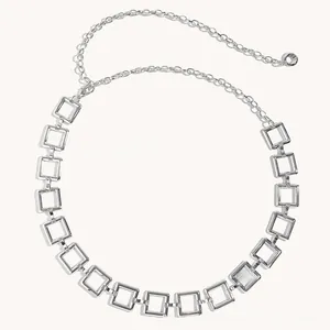 Close-up of a stylish square link silver metal waist chain with adjustable buckle