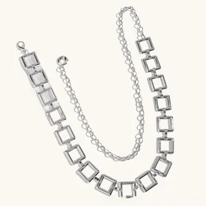 Detailed view of silver square link belt chain with lobster clasp for women