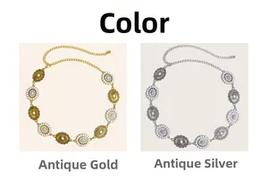 Detail view of antique gold and silver bohemian metal waist chains with floral engraving