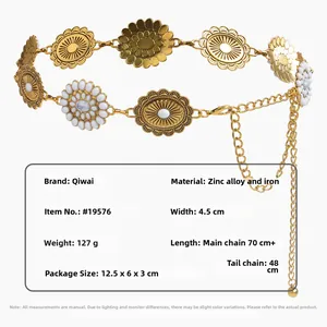 Detail of vintage hollow flower waist chain showing golden metal petal discs and white beads