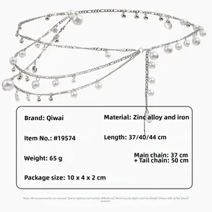 Detail of silver bohemian layered waist chain with pearls and starfish charms