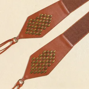 Vintage brown suede waist belt with bronze metal rivets and bohemian fringe tassels