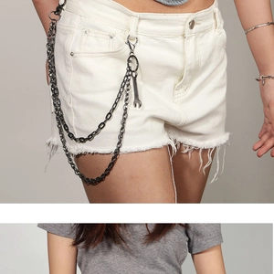 Detail view of multi-layer punk metal pant chain with wrench charm and lobster clasp
