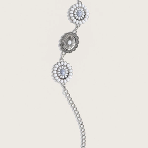 Close-up of vintage silver metal waist chain with daisy and marble stone details