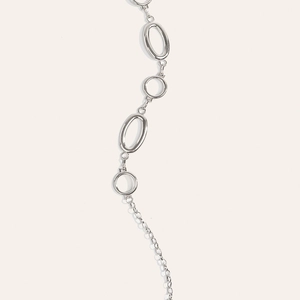 Detail of silver oval and round interlocking metal links for dress waist chain accessory