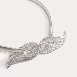 Detailed view of silver winged metal waist chain with shimmering crystals and spring link