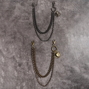 Detail of double-layered punk metal pants chain with unique cowboy hat pendant
