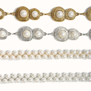 Elegant vintage metal waist chain with pearls in gold and silver finish on white backdrop