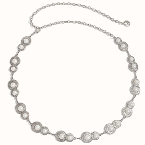 Detail of silver metal waist chain with elegant faux pearls and spiral textured settings