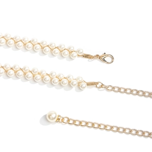 Detail of double-layer pearl chain with gold lobster clasp and adjustable extender