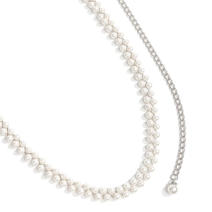 Close-up of double-row white imitation pearl waist chain with silver metal link