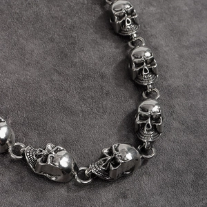 Detailed macro view of vintage silver skull chain links with punk hip-hop aesthetic