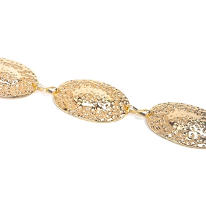 Close-up of golden western vintage metal waist chain with hammered texture oval links
