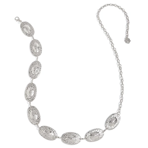 Detail of silver western metal waist chain with hammered texture oval links and floral charm