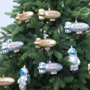 Space themed Christmas tree ornaments featuring golden airships and silver astronauts