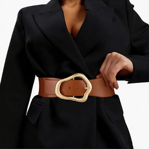 Close-up of brown elastic waist belt with unique gold irregular shaped metal buckle detail