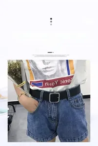 Minimalist black leather belt with silver square buckle styled on denim shorts for a daily look