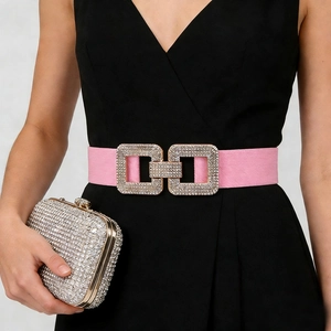 Close-up of pink elastic waist belt with sparkling rhinestone double square buckle detail