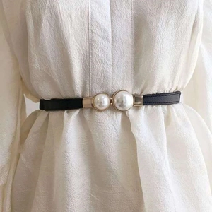 Elegant black thin leather waist belt for women with double pearls and golden buckle details