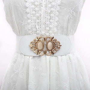 White elastic waist belt with vintage gold buckle and inset cat-eye stones for dresses