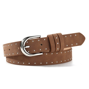 Brown suede studded belt with a silver horseshoe buckle for women’s outfits