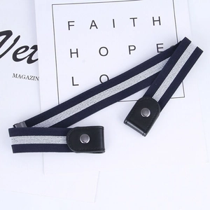 Detail of navy striped elastic buckle-free belt with silver snap and faux leather ends