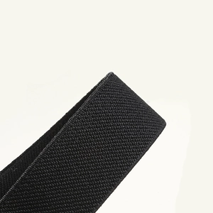 Detail shot of the black elastic band high-density weave and texture for women dresses