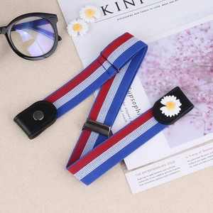 Detail of red white blue elastic no-buckle belt with daisy accent and metal buckle