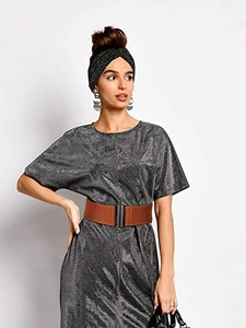 Detail view of a brown elastic wide waist belt with a metal clasp on a gray dress