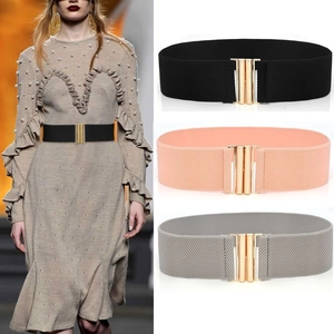 Three elastic waist belts in black, nude pink, and grey with golden buckles