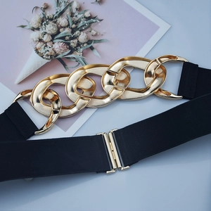 Women's black elastic waist belt featuring a bold chunky gold chain decorative buckle