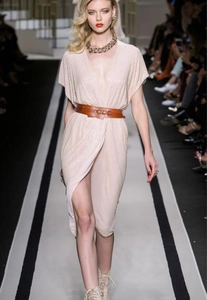 Detail of sequins on champagne dress with wide brown leather belt and metal buckle