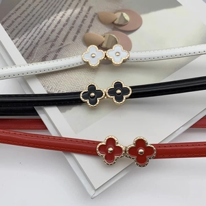 Slim minimalist leather belt for women featuring a stylish clover metal buckle design
