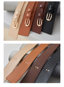Detailed view of 4-color slim leather belts with gold U-shaped buckles and refined texture