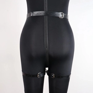 Detailed rear view of black matte bodysuit with silver metal D-ring buckle leg straps
