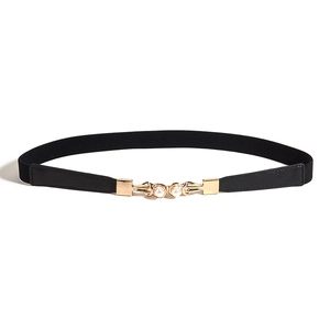 Fine ceinture élastique élégante pour femme avec boucle dorée et deux perles blanches