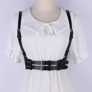 Punk Harajuku black leather harness belt with silver buckles over white dress on mannequin